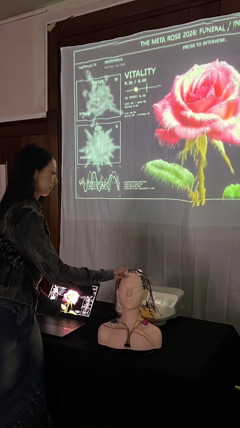 The physical-button interface and responsive digital body in Intervention, Melbourne, October 2026.